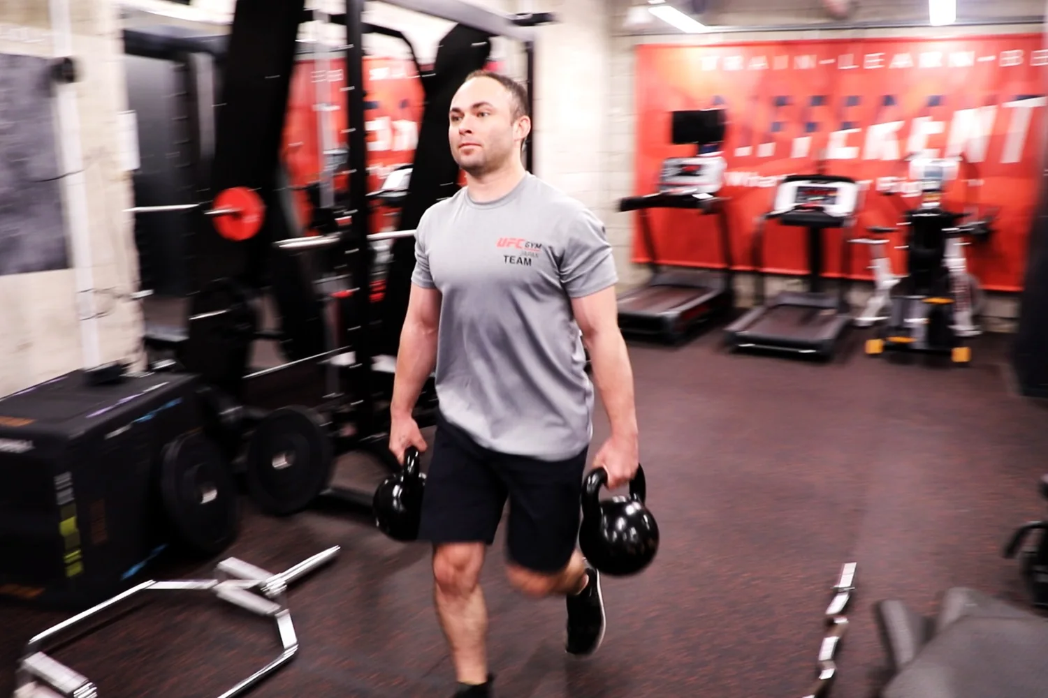 Farmers carry training with kettlebells at UFC Gym Ogikubo
